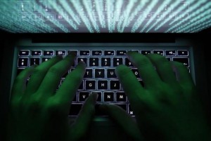 Illustration file picture shows a man typing on a computer keyboard in Warsaw