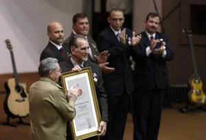 Cuba's President Raul Castro stands next to Rene Gonzalez, one of the so-called "Cuban Five" during a ceremony in Havana