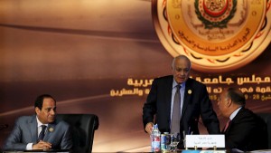 Egyptian President Abdel Fattah al-Sisi looks on to Egypt's Foreign Minister Sameh Shoukry and Arab League Secretary-General Nabil Elaraby before the start for the closing session of the Arab Summit in Sharm el-Sheikh