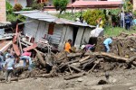 Residents remove mud and debris as they search for bodies after a landslide in the municipality of Salgar, in Antioquia department May 18, 2015. REUTERS/Stringer