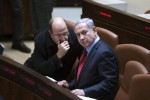 Israel's Defence Minister Moshe Yaalon (L) speaks with Prime Minister Benjamin Netanyahu during a session of the Knesset, the Israeli parliament, in Jerusalem December 1, 2014. REUTERS/Ronen Zvulun