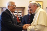 Pope Francis meets Palestinian leader Mahmoud Abbas during an audience at the Vatican Saturday, May 16, 2015. Pope Francis has praised Palestinian President Mahmoud Abbas as an "angel of peace" during a meeting at the Vatican. Francis made the compliment Saturday during the traditional exchange of gifts at the end of an official audience in the Apostolic Palace. (Alberto Pizzoli/Pool Photo via AP)