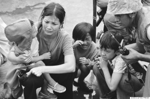 FILE - In this April 29, 1975 file photo, a South Vietnamese mother and her three children are shown on the deck of an amphibious command ship being plucked out of Saigon by U.S. Marine helicopters in Vietnam. The war ended on April 30, 1975, with the fall of Saigon, now known as Ho Chi Minh City, to communist troops from the north. (AP Photo/File)