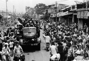 (VIETNAM-25, 3/3) A 30 April 1975 photo shows Saigon residents taking to the street to welcome the arrival of communist troops on trucks 30 April 1975 after the fall of Saigon which marked the end of the Vietnam War. Letting bygones be bygones, the United States and Vietnam have taken modest steps toward a rapprochement a quarter century after the chaotic US departure from Saigon. AFP PHOTO        (Photo credit should read AFP/AFP/Getty Images)