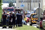 French police and firefighters gather at the entrance of the Air Products company in Saint-Quentin-Fallavier, near Lyon, central eastern France, on June 26, 2015. An attacker carrying an Islamist flag killed one person and injured several others at a gas factory in eastern France, according to a legal source. The suspected attacker entered the factory and set off several small explosive devices, the source said. A decapitated body was found nearby the factory, another source said. AFP PHOTO/PHILIPPE DESMAZE        (Photo credit should read PHILIPPE DESMAZES/AFP/Getty Images)