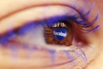 A Facebook logo reflected in the eye of a woman is seen in this picture illustration taken in Skopje November 6, 2014. REUTERS/Ognen Teofilovski