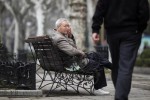 An elderly man sits at a park in Shanghai March 16, 2012.  REUTERS/Carlos Barria