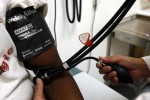 A doctor checks the blood pressure of a patient at a clinic in downtown Los Angeles July 30, 2007. REUTERS/Lucy Nicholson