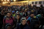 Migrants leave after failing to board a train at the train station in Tovarnik, Croatia September 19, 2015. Hungary and Croatia traded threats on Saturday as thousands of exhausted migrants poured over their borders, deepening the disarray in Europe over how to handle the tide of humanity. More than 20,000 migrants, many of them refugees from the Syrian war, have trekked into Croatia since Tuesday, when Hungary used a metal fence, tear gas and water cannon on its southern border with Serbia to bar their route into the European Union. REUTERS/Stoyan Nenov