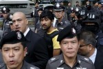 A suspect of the August 17 Bangkok blast who was arrested last week near the border with Cambodia takes part in a crime re-enactment near the bomb site at Erawan Shrine in Bangkok, Thailand, September 9, 2015.  REUTERS/Jorge Silva