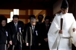 A group of lawmakers including Japan's ruling Liberal Democratic Party (LDP) lawmaker Hidehisa Otsuji (3rd L) are led by a Shinto priest as they visit to pay their respects to the war dead at the Yasukuni Shrine in Tokyo, Japan, October 20, 2015. Japan said on Monday that Prime Minister Shinzo Abe was acting in a private capacity when he sent a ritual offering to a shrine for war dead, seen as a symbol of Japan's past militarism by many in Asia, but China said he was wrong to do so. REUTERS/Yuya Shino  TPX IMAGES OF THE DAY