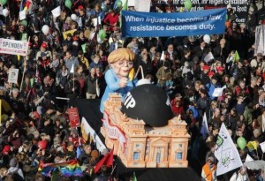 Consumer rights activists take part in a march to protest against the Transatlantic Trade and Investment Partnership (TTIP), mass husbandry and genetic engineering, in Berlin, Germany, October 10, 2015.   REUTERS/Fabrizio Bensch