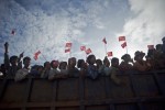 Supporters cheer as they wait for the arrival of National League for Democracy chairperson Aung San Suu Kyi during her election campaign rally in Kawhmu township on September 22, 2015. While her National League for Democracy (NLD) party is expected to triumph at key elections this year, Suu Kyi's pathway to the presidency is blocked by a controversial clause in Myanmar's junta-era constitution. AFP PHOTO / Ye Aung THU