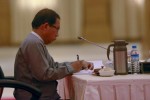 Aye Maung, a representative of Myanmar's ethnic groups, writes notes during Myanmar's top six-party talks at the Presidential palace in Naypyitaw April 10, 2015. REUTERS/Soe Zeya Tun