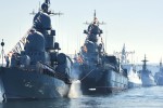 Russian navy battle ships station in the bay during a rehearsal of the Russian Navy Day parade in Sevastopol, Crimea, Friday, July 24, 2015. The Russian Navy Day is celebrated the last Sunday of July. (AP Photo/Alexander Polegenko)