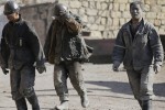 Miners walk at a coal mine from the state-owned Longmay Group on the outskirts of Jixi, in Heilongjiang province, China, October 24, 2015. To match story CHINA-COAL/JIXI      Picture taken on October 24, 2015. REUTERS/Jason Lee - RTX1USIZ