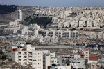 A picture taken from the West Bank city of Bethlehem (down) on December 16, 2015 shows the Israeli settlement of Hor Homa (top) in east Jerusalem. AFP PHOTO / THOMAS COEX / AFP / THOMAS COEX