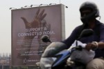 A motorist rides past a billboard displaying Facebook's Free Basics initiative in Mumbai, India, December 30, 2015. REUTERS/Danish Siddiqui