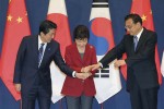 South Korean President Park Geun-hye, center, shakes hands with Japanese Prime Minister Shinzo Abe, left, and Chinese Premier Li Keqiang as they meet to hold a trilateral summit at the presidential house in Seoul, South Korea, Sunday, Nov. 1, 2015. The leaders of South Korea, China and Japan met Sunday in their first summit talks in more than three years, as the Northeast Asian powers struggle to find common ground amid bickering over history and territorial disputes. (Lee Jong-hoon/Yonhap via AP) KOREA OUT