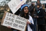 Doctors hold placards during a strike outside St Thomas' hospital in central London, Britain January 12, 2016. REUTERS/Stefan Wermuth