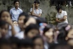 Workers from Myue & Soe Garment factory stand during a protest for salary increment in front of the Mayangone township labor office in Yangon September 7, 2012. REUTERS/Soe Zeya Tun (MYANMAR - Tags: BUSINESS EMPLOYMENT CIVIL UNREST) - RTR37MH4