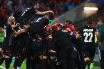 LYON, FRANCE - JUNE 19:  Albania players celebrate their team's first goal scored by Armando Sadiku (obscured) during the UEFA EURO 2016 Group A match between Romania and Albania at Stade des Lumieres on June 19, 2016 in Lyon, France.  (Photo by Michael Steele/Getty Images)