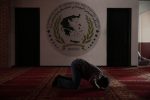 A Muslim prays inside the Greek-Arabic educational cultural centre at Moschato suburb in Athens May 24, 2013.   Greece's plan to build a state-funded mosque in the capital, more than a century in the making, comes as a relief, even if it will be housed in a disused naval base littered with weeds and rubble in a rundown neighbourhood. The mosque's critics say Athens, kept afloat by an international bailout, cannot spare the almost one million euros it will cost given that Greece is in a sixth year of recession, with record high unemployment and sinking living standards.   Picture taken May 24, 2013.   REUTERS/Yorgos Karahalis (GREECE - Tags: POLITICS BUSINESS SOCIETY RELIGION IMMIGRATION) - RTX11330