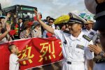 Captain Wang Hong Li, commanding officer of 23rd Chinese naval escort task force, greets local Chinese upon arrival at the Thilawa International Port, Friday, Sept. 30, 2016, in Yangon, Myanmar. Two Chinese naval frigates are paying a port call at the Thilawa port of Myanmar's old capital Yangon. (AP Photo/Thein Zaw)