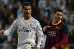 Real Madrid's Portuguese forward Cristiano Ronaldo (L) and Barcelona's Argentinian forward Lionel Messi look on during the Spanish league "Clasico" football match Real Madrid CF vs FC Barcelona at the Santiago Bernabeu stadium in Madrid on March 23, 2014.   AFP PHOTO/ GERARD JULIEN        (Photo credit should read GERARD JULIEN/AFP/Getty Images)