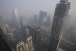 Buildings are pictured amid the smog in Beijing's central business district, China, December 21, 2015. REUTERS/Jason Lee/Files