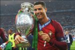 Portugal's forward Cristiano Ronaldo smiles while posing with the trophy after Portugal won the Euro 2016 final football match between Portugal and France at the Stade de France in Saint-Denis, north of Paris, on July 10, 2016. / AFP / FRANCISCO LEONG        (Photo credit should read FRANCISCO LEONG/AFP/Getty Images)