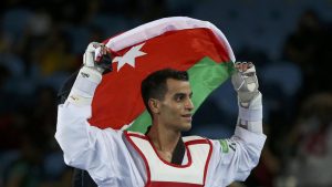 2016 Rio Olympics - Taekwondo - Men's -68kg Gold Medal Finals - Carioca Arena 3 - Rio de Janeiro, Brazil - 18/08/2016. Ahmad Abughaush (JOR) of Jordan celebrates after defeating Alexey Denisenko (RUS) of Russia. REUTERS/Issei Kato (BRAZIL  - Tags: SPORT OLYMPICS SPORT TAEKWONDO) FOR EDITORIAL USE ONLY. NOT FOR SALE FOR MARKETING OR ADVERTISING CAMPAIGNS.