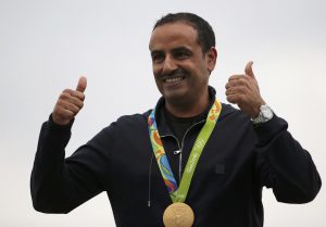 2016 Rio Olympics - Shooting - Victory Ceremony - Men's Double Trap Victory Ceremony - Olympic Shooting Centre - Rio de Janeiro, Brazil - 10/08/2016. Fehaid Aldeehani (KUW) of Independent Olympic Athlete poses with his gold medal. REUTERS/Edgard Garrido  FOR EDITORIAL USE ONLY. NOT FOR SALE FOR MARKETING OR ADVERTISING CAMPAIGNS.