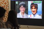 Passersby watch a TV news reporting that Princess Mako, the granddaughter of Japan's emperor, is getting married to Kei Komuro, in Tokyo Tuesday, May 16, 2017. Komuro, the man who won the princess' heart, was a fellow student at International Christian University in Tokyo, where Mako, 25, also graduated, public broadcaster NHK TV said. (Hitoshi Takano/Kyodo News via AP)