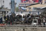 Afghan security forces inspect the site of a Taliban-claimed deadly suicide attack in Kabul, Afghanistan, Tuesday, April 19, 2016. Armed militants in Afghanistan have staged a coordinated assault on a key government security agency in the capital Tuesday morning, killing many and wounding more than 320 people. (AP Photo/Rahmat Gul)