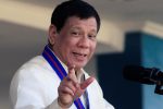 Philippine President Rodrigo Duterte gestures as he delivers his speech during the 116th Police Service Anniversary inside the Philippine National Police (PNP) headquarters in Quezon city, metro Manila, Philippines August 9, 2017.  REUTERS/Romeo Ranoco