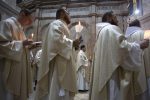 Christian clergymen hold candles during the Easter Sunday procession at the Church of the Holy Sepulchre, traditionally believed by many Christians to be the site of the crucifixion and burial of Jesus Christ, in Jerusalem, Sunday, April 16, 2017. Millions of Christians around the world are celebrating Easter commemorating the day when according to Christian tradition Jesus was resurrected in Jerusalem. (AP Photo/Sebastian Scheiner)