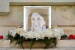 Flowers and tributes lay at the foot of the Great Siege monument in Valletta, Malta, on October 19, 2017 which has been turned into a temporary shrine for Maltese journalist and blogger Daphne Caruana Galizia (picture) who was killed by a car bomb outside her home in Bidnjia, Malta, on October 16, 2017. / AFP PHOTO / Matthew Mirabelli