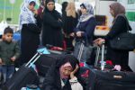 Palestinians wait for travel permits to cross into Egypt, for the first time after Hamas ceded Rafah border crossing to the Palestinian Authority, in Khan Younis in the southern Gaza Strip November 18, 2017.  REUTERS/Ibraheem Abu Mustafa