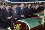 From right, Prime Minister Justin Trudeau,  Quebec Premier Philippe Couillard, Quebec City Mayor Regis Labeaume and Montreal Mayor Denis Coderre pay their respects to three of the six victims of the Quebec City mosque shooting, Abdelkrim Hassane, Khaled Belkacemi and Aboubaker Thabti,  during the funeral at the Maurice Richard Arena in Montreal, Thursday, Feb.  2, 2017.   (Paul Chiasson/The Canadian Press via AP)