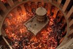 TOPSHOT - Christian Orthodox worshippers hold up candles lit from the "Holy Fire" as thousands gather in the Church of the Holy Sepulchre in Jerusalem's Old City, on April 30, 2016, during the Orthodox Easter ceremonies.
The ceremony celebrated in the same way for eleven centuries, is marked by the appearance of "sacred fire" in the two cavities on either side of the Holy Sepulchre. / AFP / THOMAS COEX        (Photo credit should read THOMAS COEX/AFP/Getty Images)