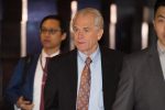 White House economic adviser Peter Navarro (C) walks through a hotel lobby as he heads to the Diaoyutai State Guest House to meet Chinese officials for ongoing trade talks in Beijing on May 4, 2018.
Top US and Chinese officials kicked off crucial trade talks on May 3 in Beijing but both sides sought to dampen expectations for a quick resolution to a heated dispute between the world's two largest economies. / AFP PHOTO / NICOLAS ASFOURI