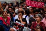 Indian protesters hold placards as they gather for a 'Not in my name' silent protest at Jantar Mantar in New Delhi on June 28, 2017, following a spate anti-Muslim killings.
A mob stabbed a Muslim teenager Junaid Khan, 15, who was travelling from New Delhi on June 24 with three of his brothers when a fight erupted over seats. The incident is the latest such attack by Hindu vigilantes in India, where there have been a spate of assaults against Muslims and low-caste Dalits. / AFP PHOTO / CHANDAN KHANNA