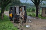 This photo taken on July 10, 2018 shows Indian security personnel near the site of the lynching of two men in Panjuri Kachari village, in Karbi Anglong district some 180km from Guwahati, the capital city of Indias northeastern state of Assam.
The smartphone footage shows the two blood-soaked men pleading for their lives. Moments later they were dead, two more victims of lynchings sparked by rumours spread on Facebook and WhatsApp in India. Abhijeet Nath and Nilotpal Das were beaten to death by a mob in Karbi Anglong district that suspected the youths to be child abductors on June 8.
 / AFP PHOTO / Biju BORO / TO GO WITH INDIA-TECHNOLOGY-MEDIA-INTERNET,FOCUS by Alexandre MARCHAND