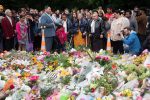 Samoan church members sing next to floral tributes in Christchurch on March 17, 2019 two days after a shooting incident at two mosques in the city. - New Zealanders flocked to memorial sites to lay flowers and mourn the victims of the twin mosque massacres on March 17, as testimony emerged of epic heroism and harrowing suffering in the gun attack that has claimed 50 lives. (Photo by Marty MELVILLE / AFP)