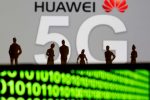 FILE PHOTO: Small toy figures are seen in front of a displayed Huawei and 5G network logo in this illustration picture, March 30, 2019. REUTERS/Dado Ruvic/Illustration