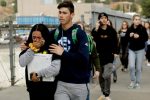 Students are escorted outside of Saugus High School after reports of a shooting on Thursday, Nov. 14, 2019, in Santa Clarita, Calif. (AP Photo/Marcio Jose Sanchez)