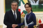 Myanmar's leader Aung San Suu Kyi, right, shakes hands with Chinese Foreign Minister Wang Yi, left, during their meeting at the President House in Naypyitaw, Myanmar, Saturday, Dec. 7, 2019. (AP Photo/Aung Shine Oo)