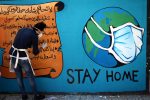 Palestinian artists draw a mural "stay home" during awareness campaign about the spread of coronavirus disease (COVID-19), in Gaza city, on April 2, 2020. The United Nations has warned that a COVID-19 outbreak in Gaza could be disastrous, given the high poverty rates and weak health system in the coastal strip under Israeli blockade since 2007. Authorities in Gaza have said that more than 2,700 Palestinians are in home-isolation, mostly people who had returned from Egypt. Photo by Mahmoud Ajjour