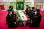 FILE PHOTO: Mourners sit next to the coffin of Iranian nuclear scientist Mohsen Fakhrizadeh, during the burial ceremony at the shrine of Imamzadeh Saleh, in Tehran, Iran November 30, 2020. Hamed Malekpour/WANA (West Asia News Agency) via REUTERS/File Photo